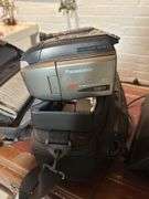 Old Sony tv, floor lamp, Yamaha stereo cassette deck, DVDs,  Panasonic movie camera, & canon movie camera. In basement