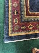 Hand knotted wool rug (missing some edging) 58” x 77”