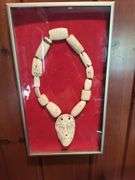 African Bone necklace in frame, tribal piece in frame
