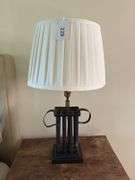29” black lamp with shade. Base is wood and metal. Does have dent