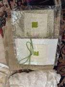 Contents of cabinet- Ann Gish and misc designer table linens, sheets, silks and artisan beeswax and misc candles, 90” round silk table cloth.