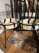 Step trash can, gate, round table, pair of tall dog dishes. In basement