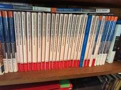 2 shelves of books mostly medical