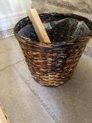 Large blue ceramic planter with live plants in and wicker basket