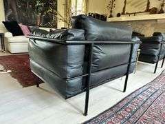 Pair of Montis black leather and tubular metal chairs in the manner of Le Corbusier LC3 armchair, excellent vintage condition