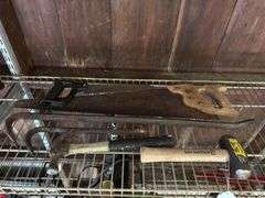 2 hammers, saws, and pry bars