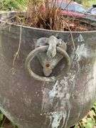 Very heavy cast iron pot with brass ring handles, 20”d x 24”h, (heavy items, must have your own help to load)