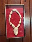 African Bone necklace in frame, tribal piece in frame