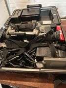Old Sony tv, floor lamp, Yamaha stereo cassette deck, DVDs,  Panasonic movie camera, & canon movie camera. In basement