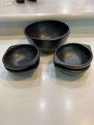 Black stoneware serving bowl and 4 salad bowls, “earth cold leaf”