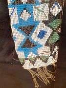 Framed beaded sash, (broken glass) 7” x 36”