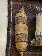 29” x 44” woven rug, matted and framed 20” x 17” picture “coyote 76” throw pillow, woven basket