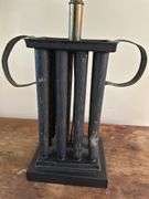 29” black lamp with shade. Base is wood and metal. Does have dent