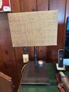 Lamp with metal tribal base