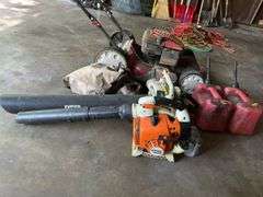 Troy-bilt  push mower, 2 gas powered blowers 2 plastic gas cans