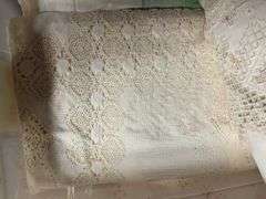 1 box & 1 tub of  queen size comforter and  tablecloths and lace
