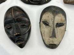 Group of Five Carved Tribal-Style Masks