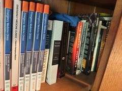 2 shelves of books mostly medical