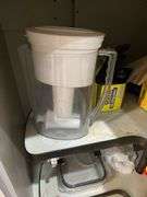 Ceramic platter, plastic containers, Cuisinart salt and pepper mills, Brita water pitcher, miscellaneous