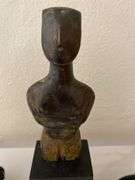 Stone carved figurine on wood base, lidded seed pod, etched egg on wood base