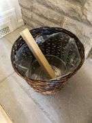 Large blue ceramic planter with live plants in and wicker basket