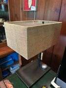 Lamp with metal tribal base