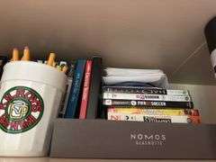 Items on top shelve XBOX 360 games, DVDs , books & misc