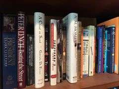 Shelf of hardback books