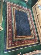 Hand knotted wool rug (missing some edging) 58” x 77”