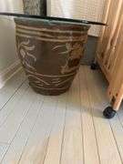 30” glass top on top of large black egg Chinese planter