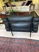 Pair of Montis black leather and tubular metal chairs in the manner of Le Corbusier LC3 armchair, excellent vintage condition