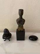 Stone carved figurine on wood base, lidded seed pod, etched egg on wood base