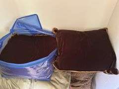 Left side of closet: rollerblades, backpack, brown velour pillows, king size pillow,  small comforters  50” X 65”,