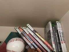 Items on top shelve XBOX 360 games, DVDs , books & misc
