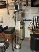 Old Sony tv, floor lamp, Yamaha stereo cassette deck, DVDs,  Panasonic movie camera, & canon movie camera. In basement