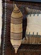 29” x 44” woven rug, matted and framed 20” x 17” picture “coyote 76” throw pillow, woven basket