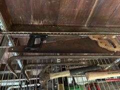 2 hammers, saws, and pry bars
