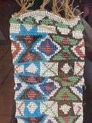Framed beaded sash, (broken glass) 7” x 36”