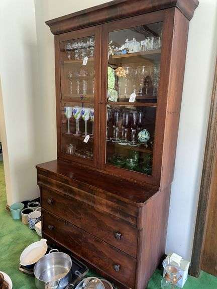 2 piece Antique walnut step back cabinet with wavy glass doors