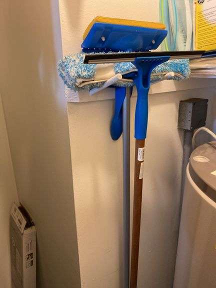 Contents of kitchen closet, step stool, ironing board, brooms, extension cords (excludes items on shelf)