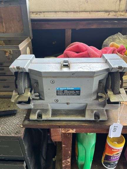 Wood bench w/ double end grinder, yard chemicals, rope, plastic owl & misc