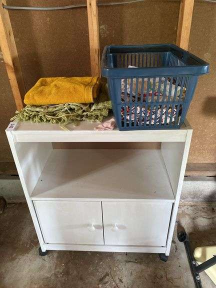 Roll around cabinet, tablecloths, rug, towel