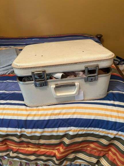Vintage suitcase with dolls and clothes image