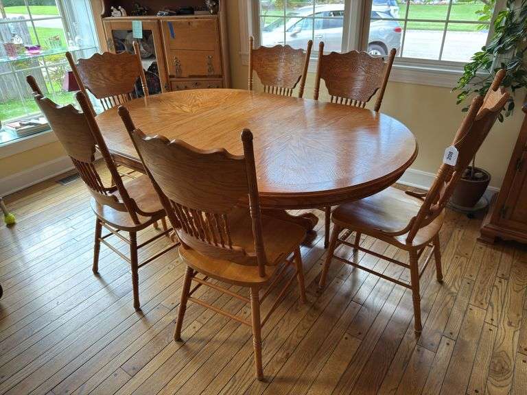 Oak veneer single pedestal table with claw & ball feet & 6 press back chairs image