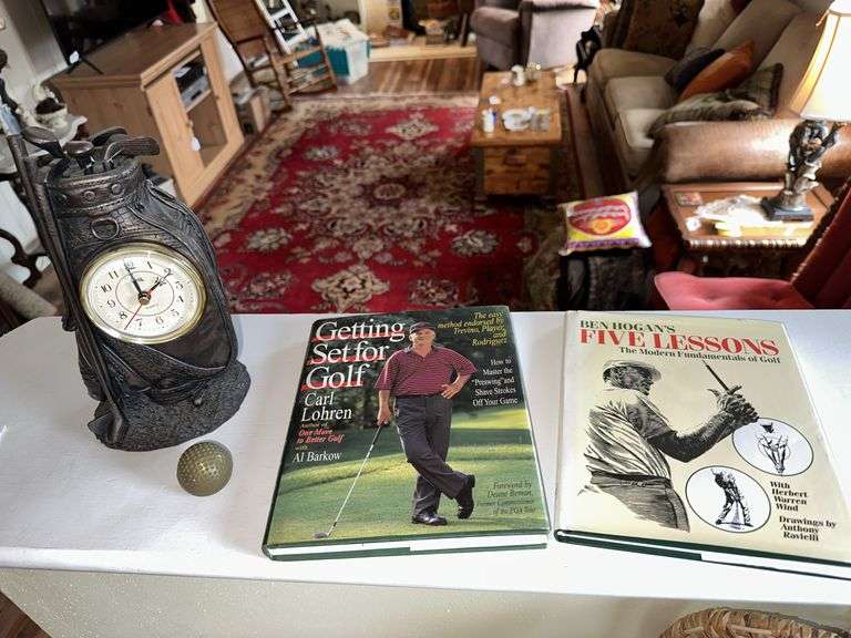 2 golf books, clock, brass golf ball image