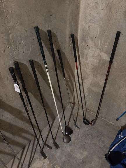 Misc golf clubs including hybrids, wedges, 5 wood image
