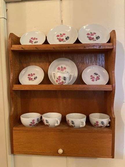 Miniature tea set on wall display image