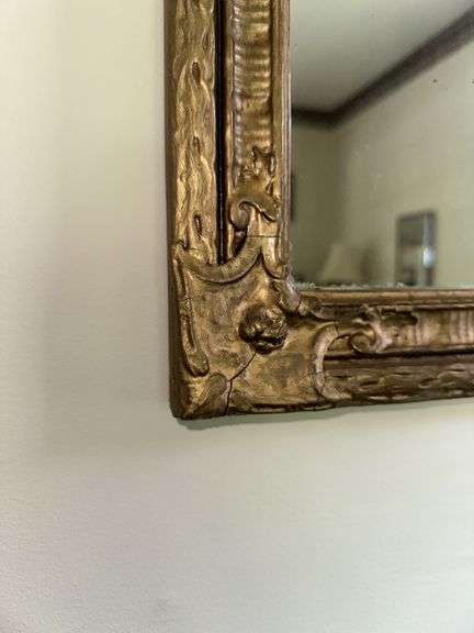 Antique bell pull with cross stitch, ornate framed mirror