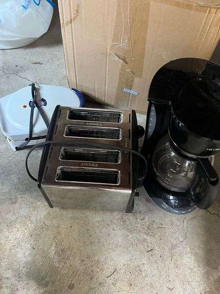 Toaster, coffee maker, waffle iron, plate holders,  plastic containers image