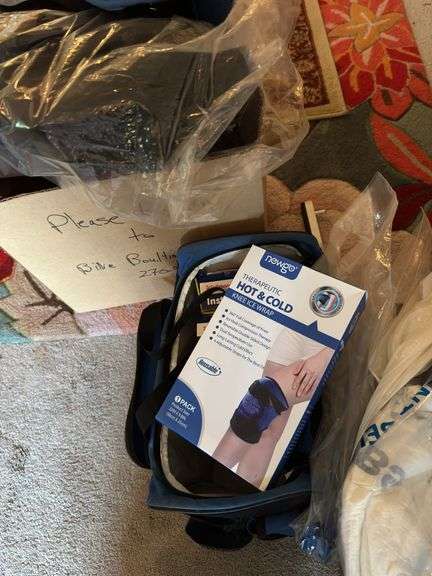 Short air walker boot , 2 boxes of instant cold packs, grabber, knee brace, bed pad, & misc image